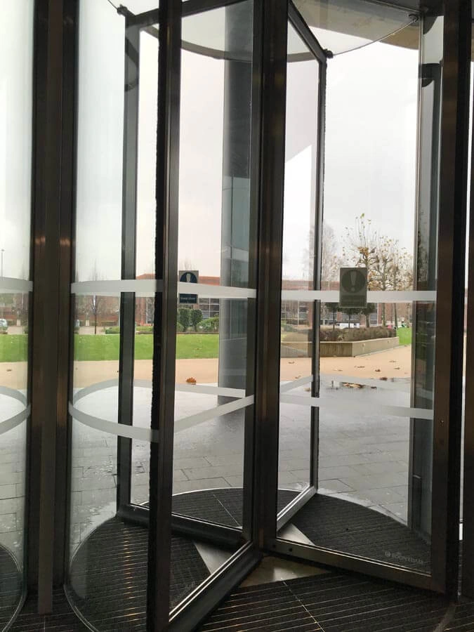 Revolving Door Anti Shatter Film by AW Sign Services.