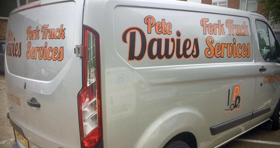 Branded van signage on a commercial van.